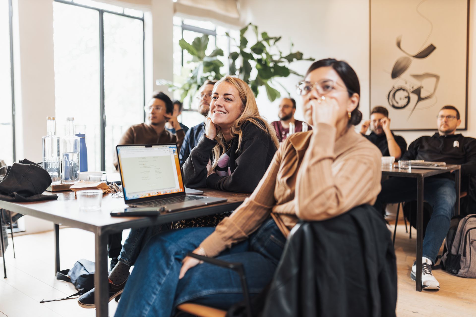 Workshop attendees listening during a group session